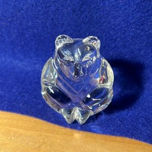 Steuben hand warmer sitting near baccarat crystal